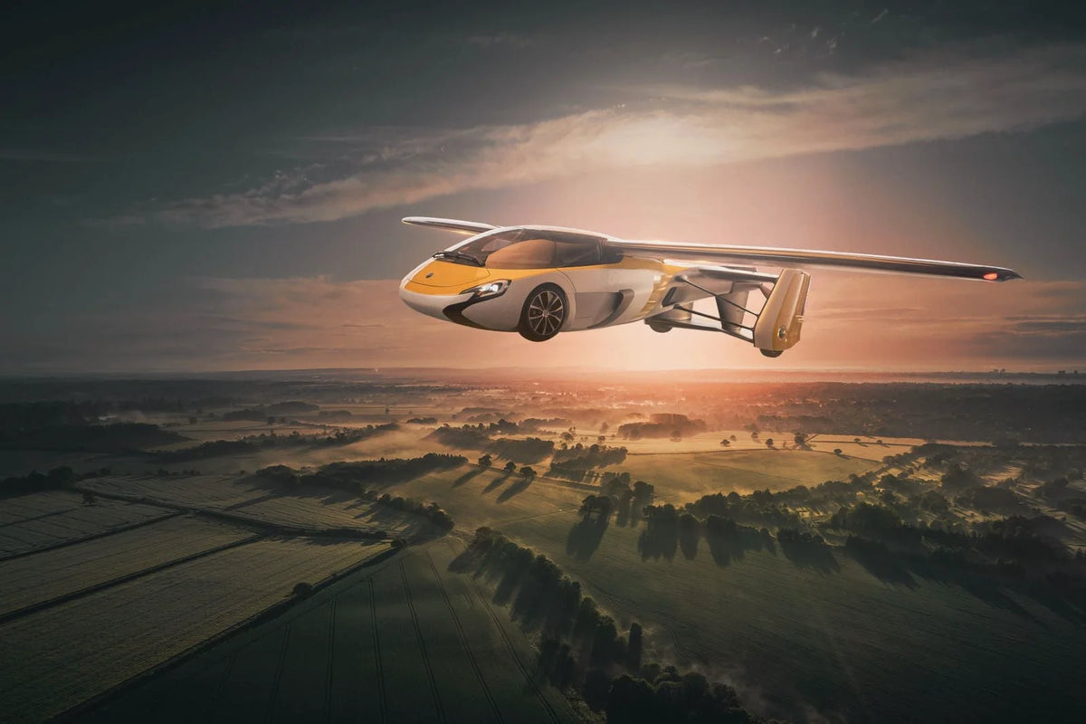 Light single-seat propeller aircraft flying over farmland at sunset