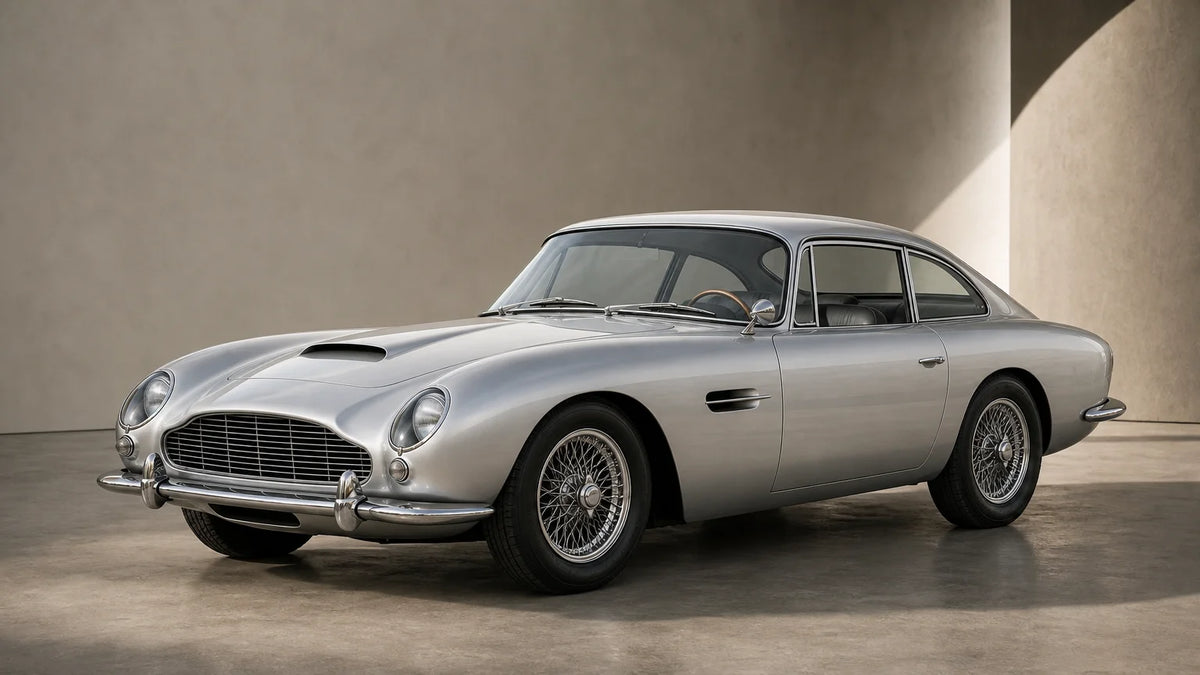 Silver 1960s grand touring coupe presented in a minimalist studio