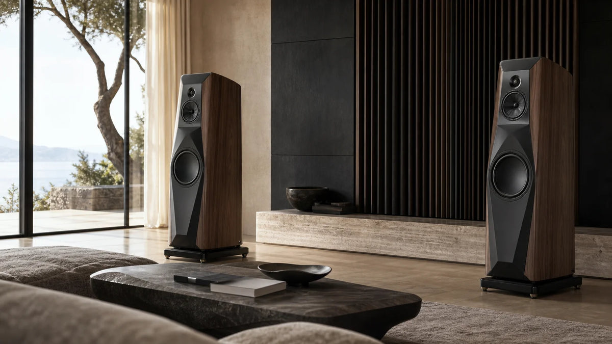 Pair of sculptural high-end floorstanding speakers in a refined luxury listening room