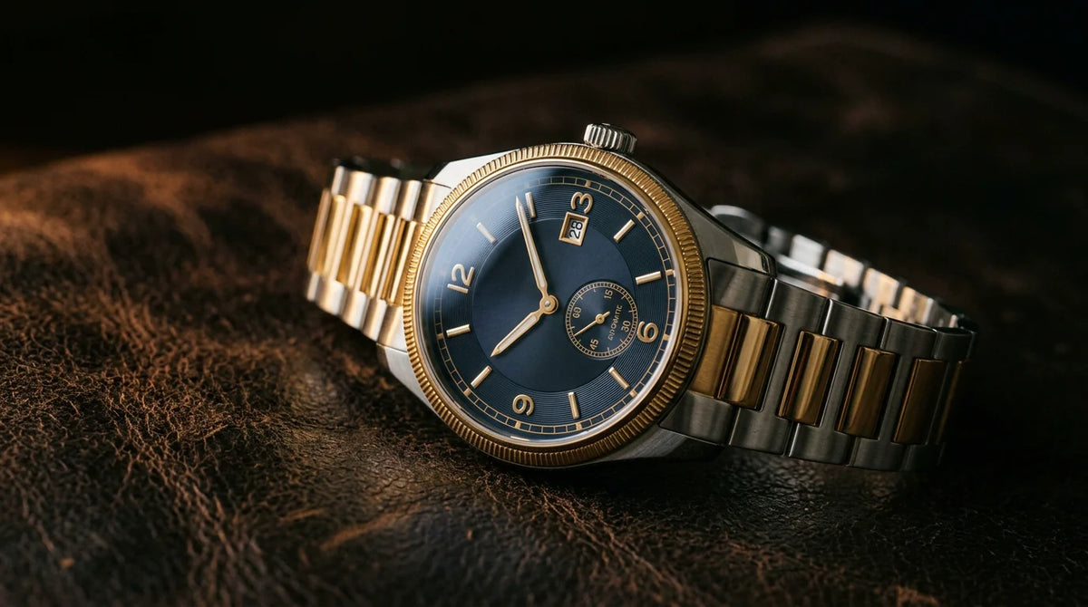 A luxury mechanical wristwatch on dark leather under dramatic editorial lighting