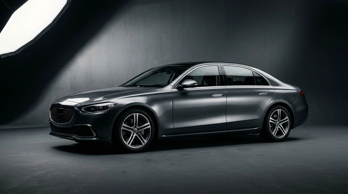 Luxury sedan photographed in a professional studio setting