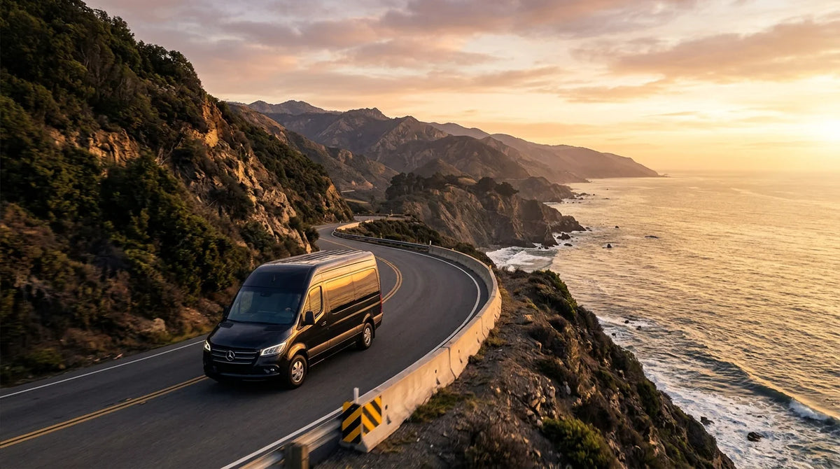 Luxury van driving on a scenic coastal road at golden hour