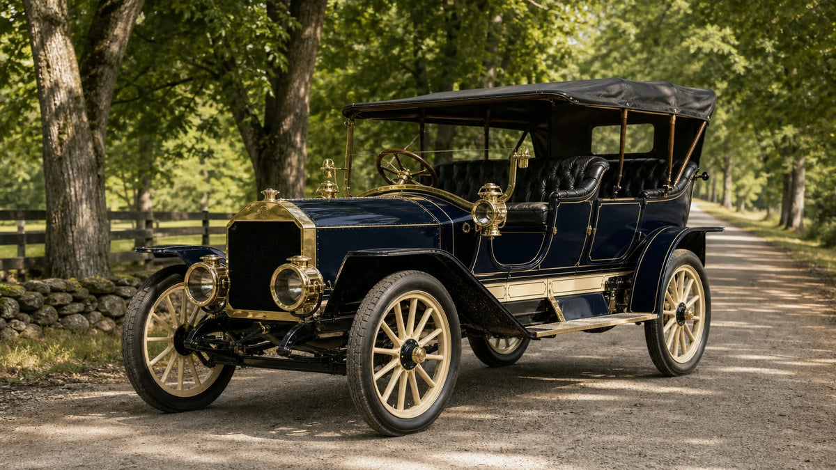 Historically styled 1905 American open touring automobile with brass details and wooden-spoke wheels on a rural road