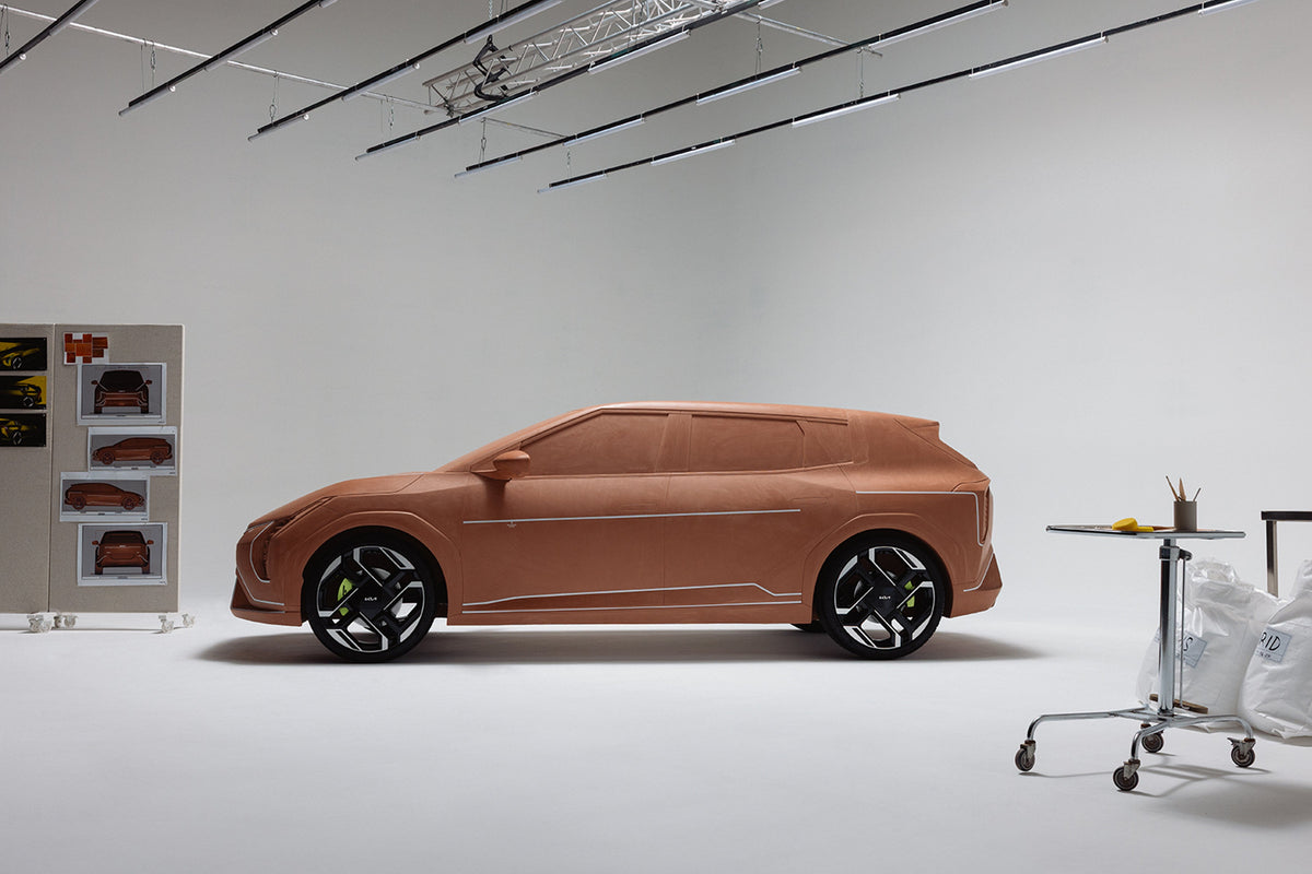 Rafael Nadal beside Kia’s full-size EV4 GT clay sculpture — official Kia photo